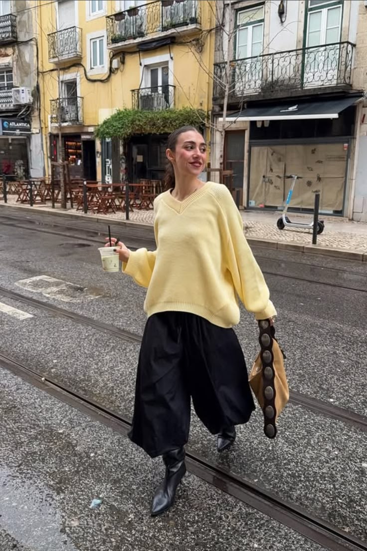 20 Chic Rainy Day Outfits That Make Bad Weather Look Surprisingly Stylish - 15. Sunshine Yellow and Black Culottes 1