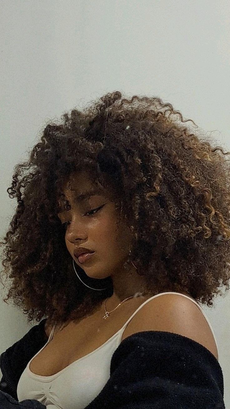 20 Expert Tips for Maintaining Your Voluminous Curly Afro Like a Pro! - 16. Incorporate Natural Oils 1