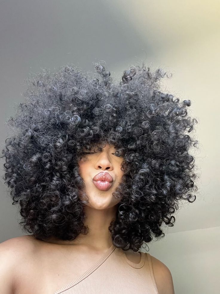 20 Expert Tips for Maintaining Your Voluminous Curly Afro Like a Pro! - 9. Protect from Sun Damage 1