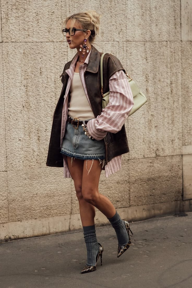 20 Milan Street Style Looks That Prove Italian Women Own Fall Fashion - 11. Leather Vest, Soft Stripes, and Denim Shorts 1
