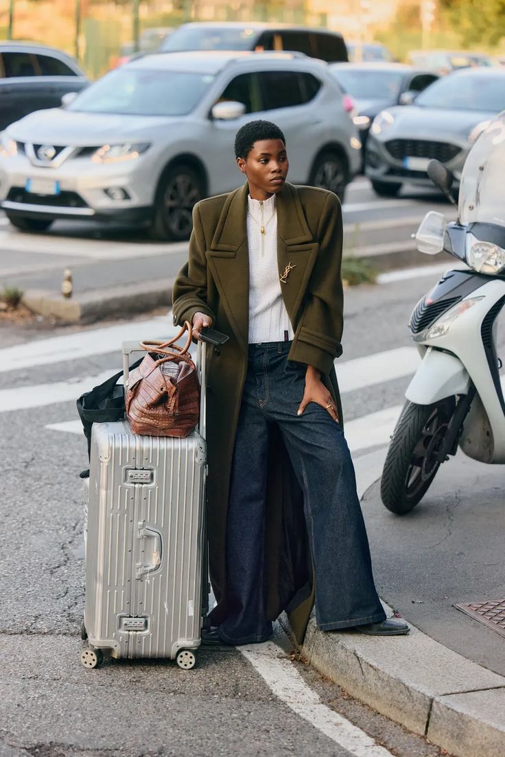 20 Milan Street Style Looks That Prove Italian Women Own Fall Fashion - 19. Travel-Ready Olive Blazer with Wide Denim 1
