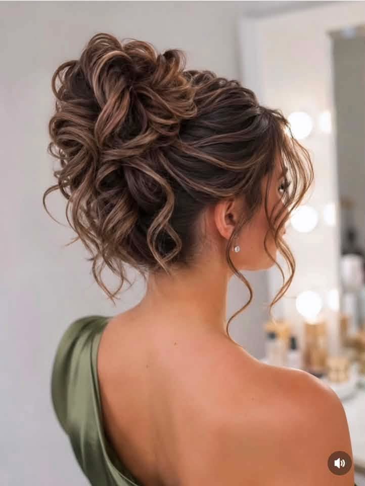 20 Stunning Curly Bridal Updos That Will Make You Feel Like the Belle of the Ball - 8. The High Volume Satin-Bun Look 1