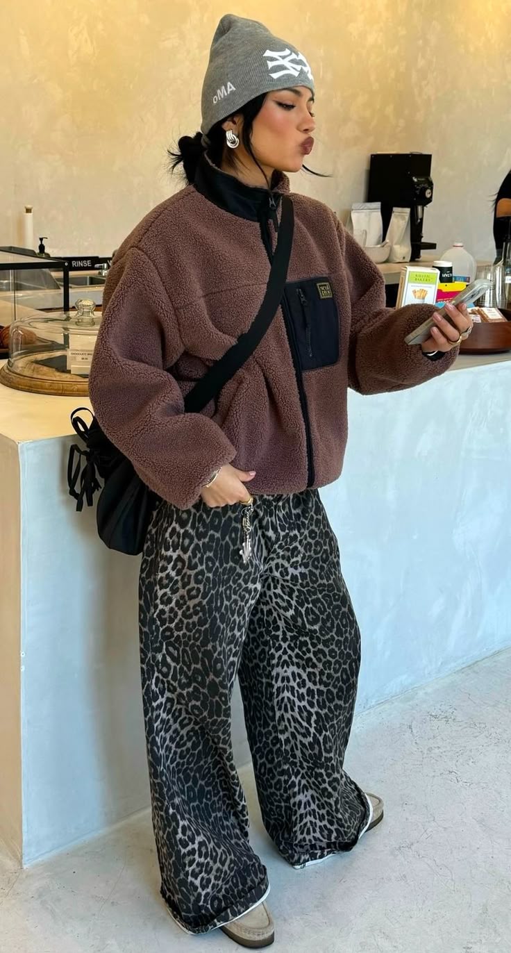 20 Winter Street Style Outfits That Look Effortlessly Cool (Even on the Coldest Days!) - 11. Cozy Fleece and Leopard Pants 1