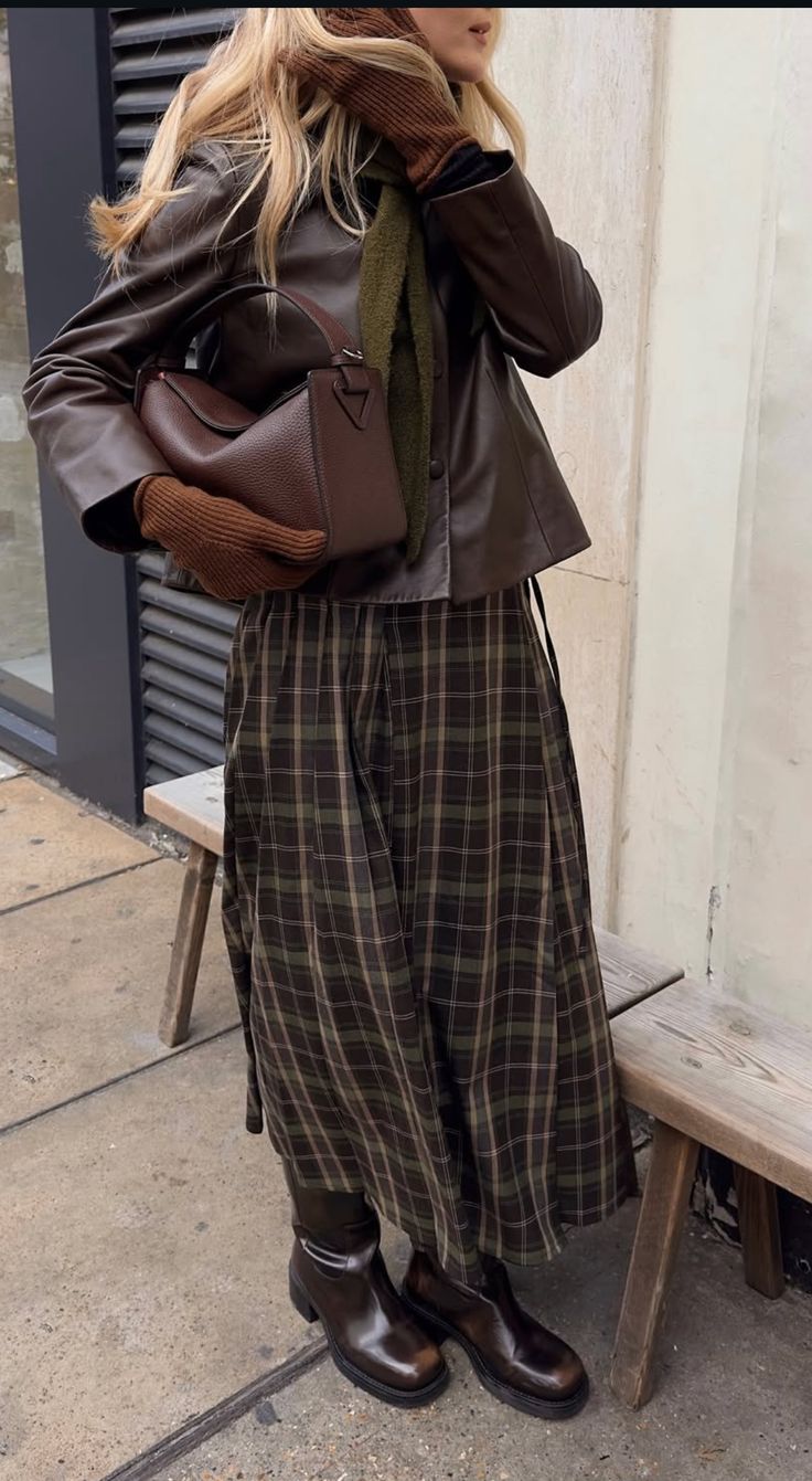 20 Winter Street Style Outfits That Look Effortlessly Cool (Even on the Coldest Days!) - 14. Plaid Midi Skirt with Leather Jacket Layers 1