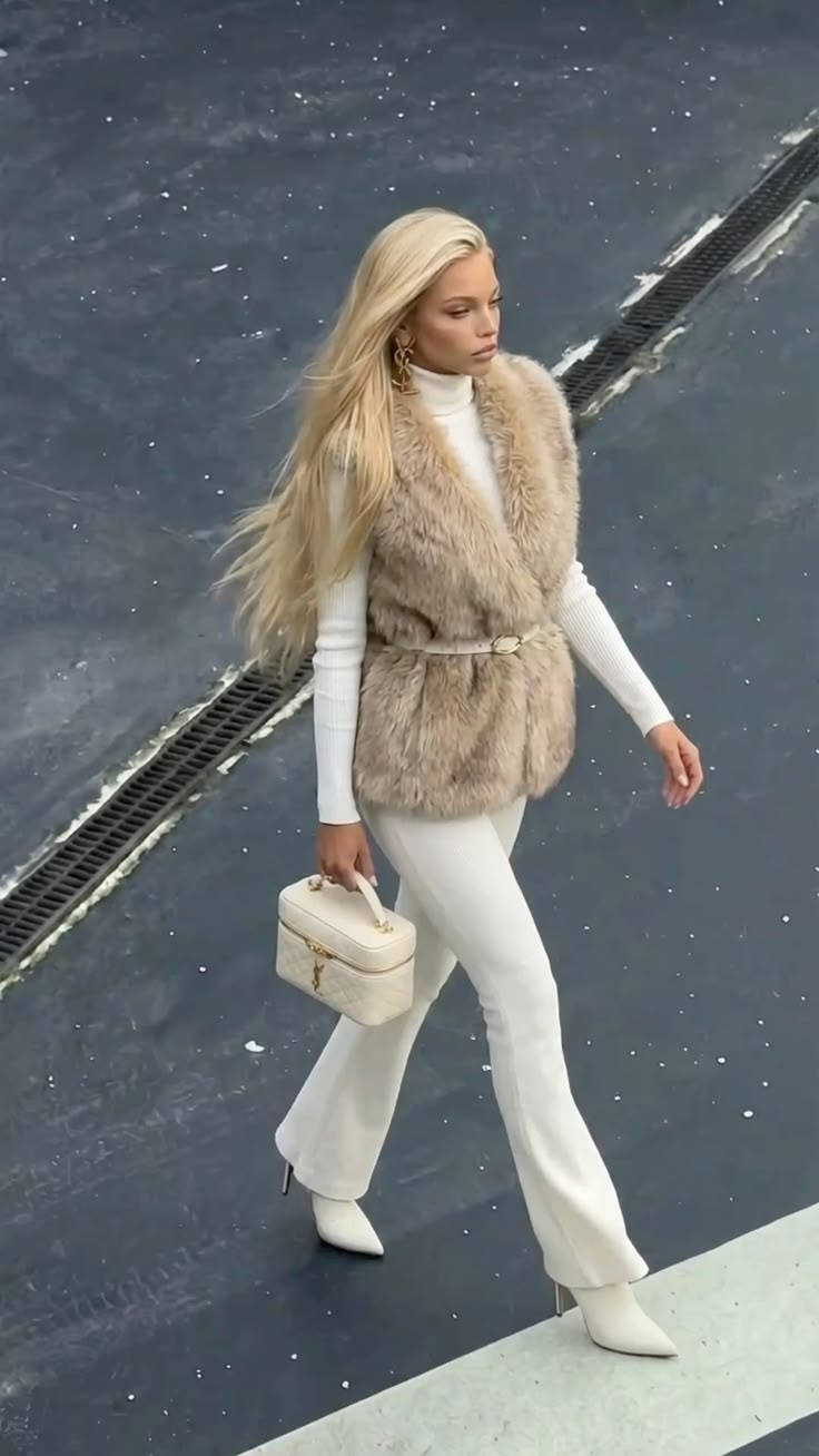 20 All-White Winter Party Outfits That Look Seriously Expensive (You’ll Want to Copy #7!) - 15. The Belted Faux-Fur Vest over a White Winter Base 1