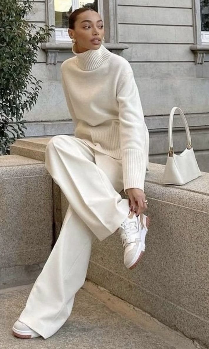 20 All-White Winter Party Outfits That Look Seriously Expensive (You’ll Want to Copy #7!) - 8. The Cream Sweater and Wide-Leg Trouser Look with Sneakers 1