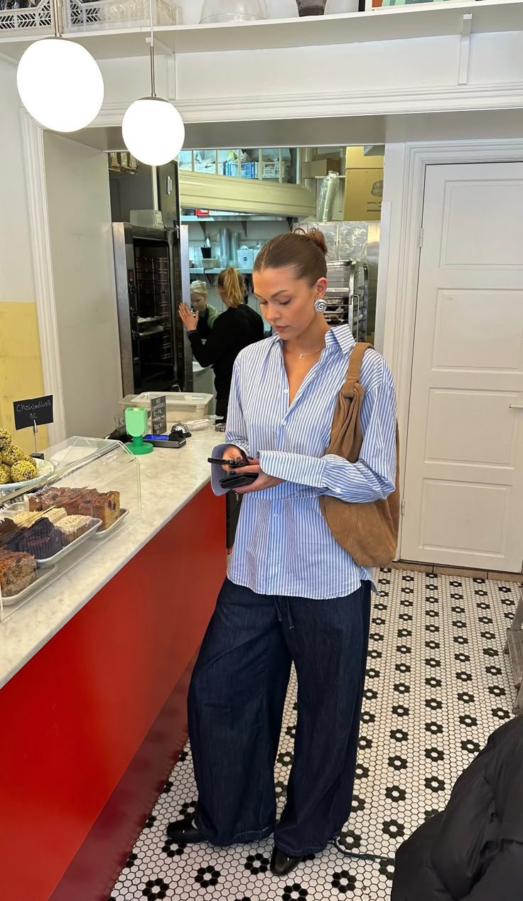 20 Blue Shirt Outfits That Make Casual Style Look Effortlessly Chic (#9 Is a Total Game-Changer!) - 15. Blue Pinstripes, Dark Jeans, and a Soft Shoulder Bag 1