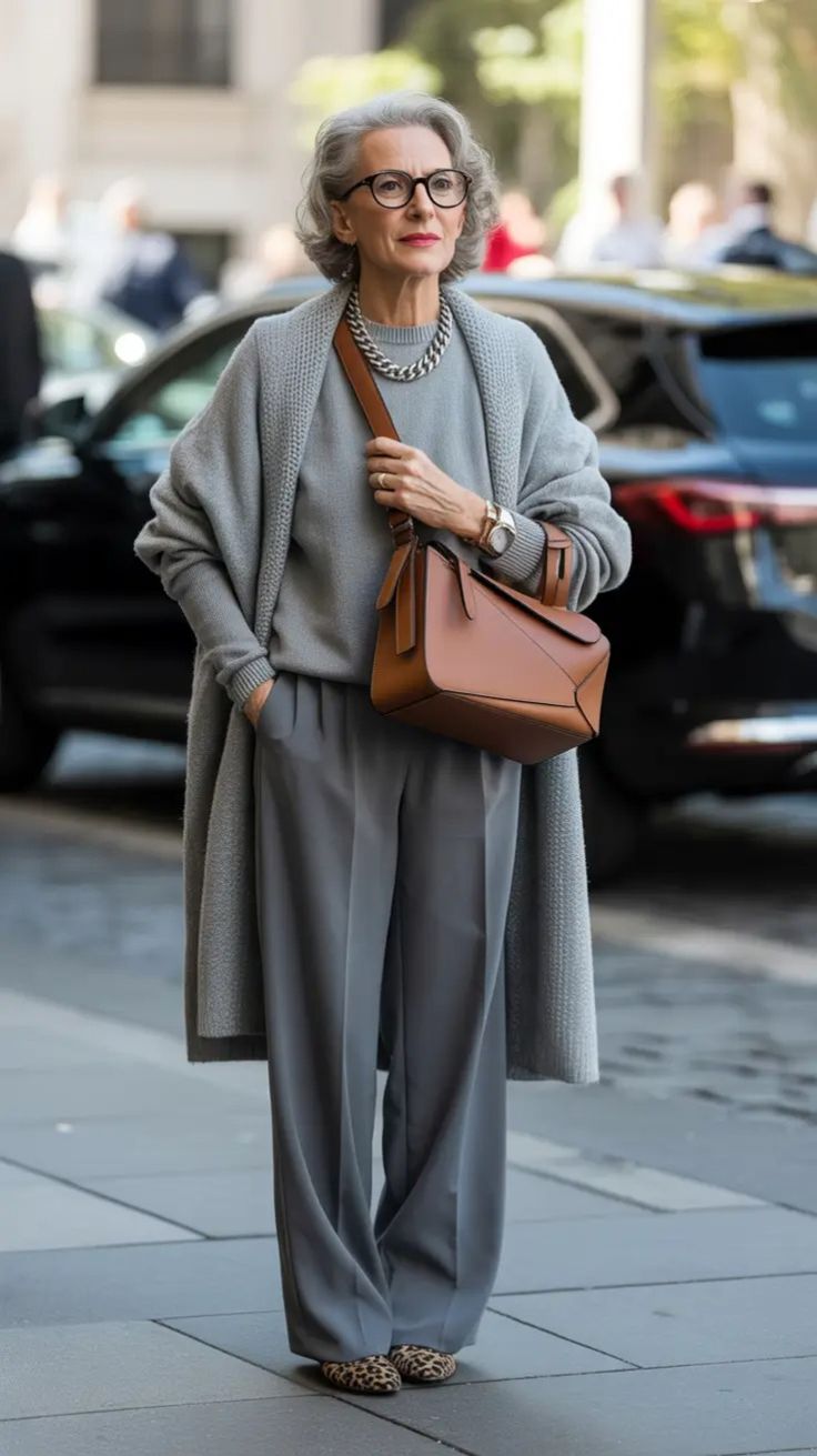 20 Elegant Winter Outfits for Women Over 50 That Look Timeless and Sophisticated - 17. Gray Cardigan, Fluid Trousers, and Leopard Flats 1
