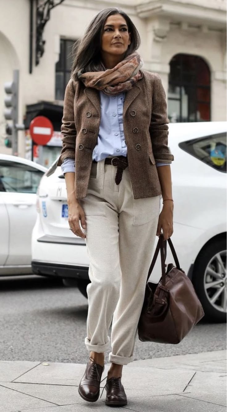 20 Elegant Winter Outfits for Women Over 50 That Look Timeless and Sophisticated - 6. Tweed Blazer with Pale Trousers and a Printed Scarf 1
