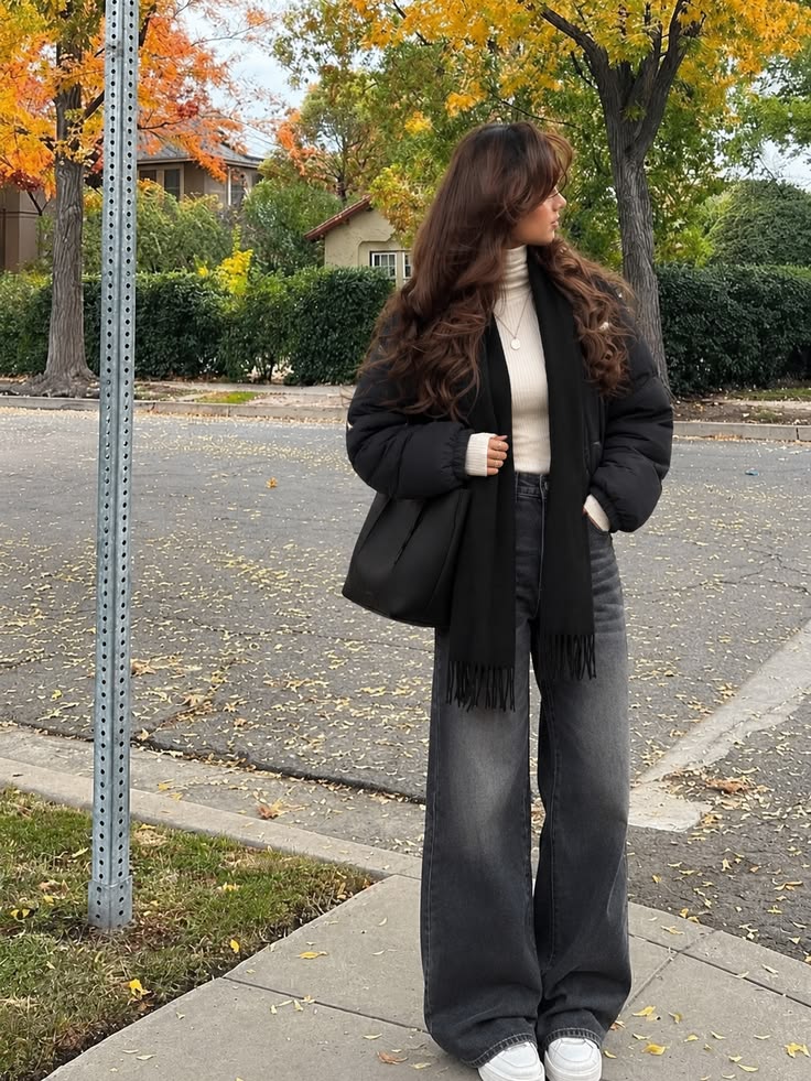20 “I Just Threw This On” Winter Outfits That Look Anything But Random - 2. The Black Puffer and Cream Turtleneck Formula 1