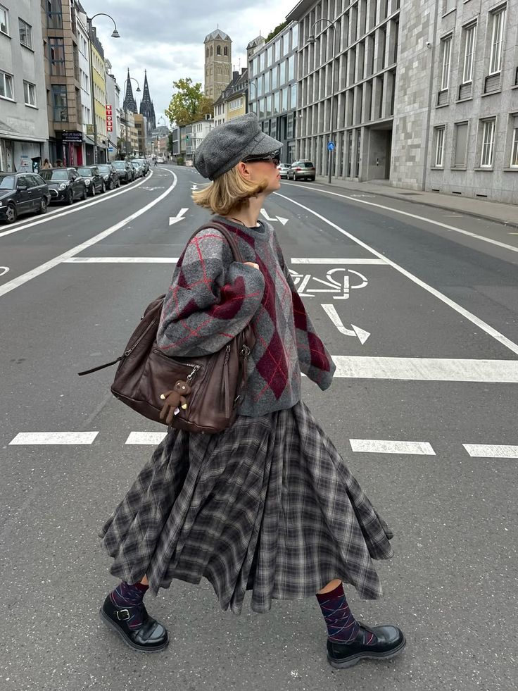20 Plaid Sweater Ideas That Bring Instant Classic Style to Any Outfit - 2. City Girl Argyle with a Swishy Plaid Skirt 1
